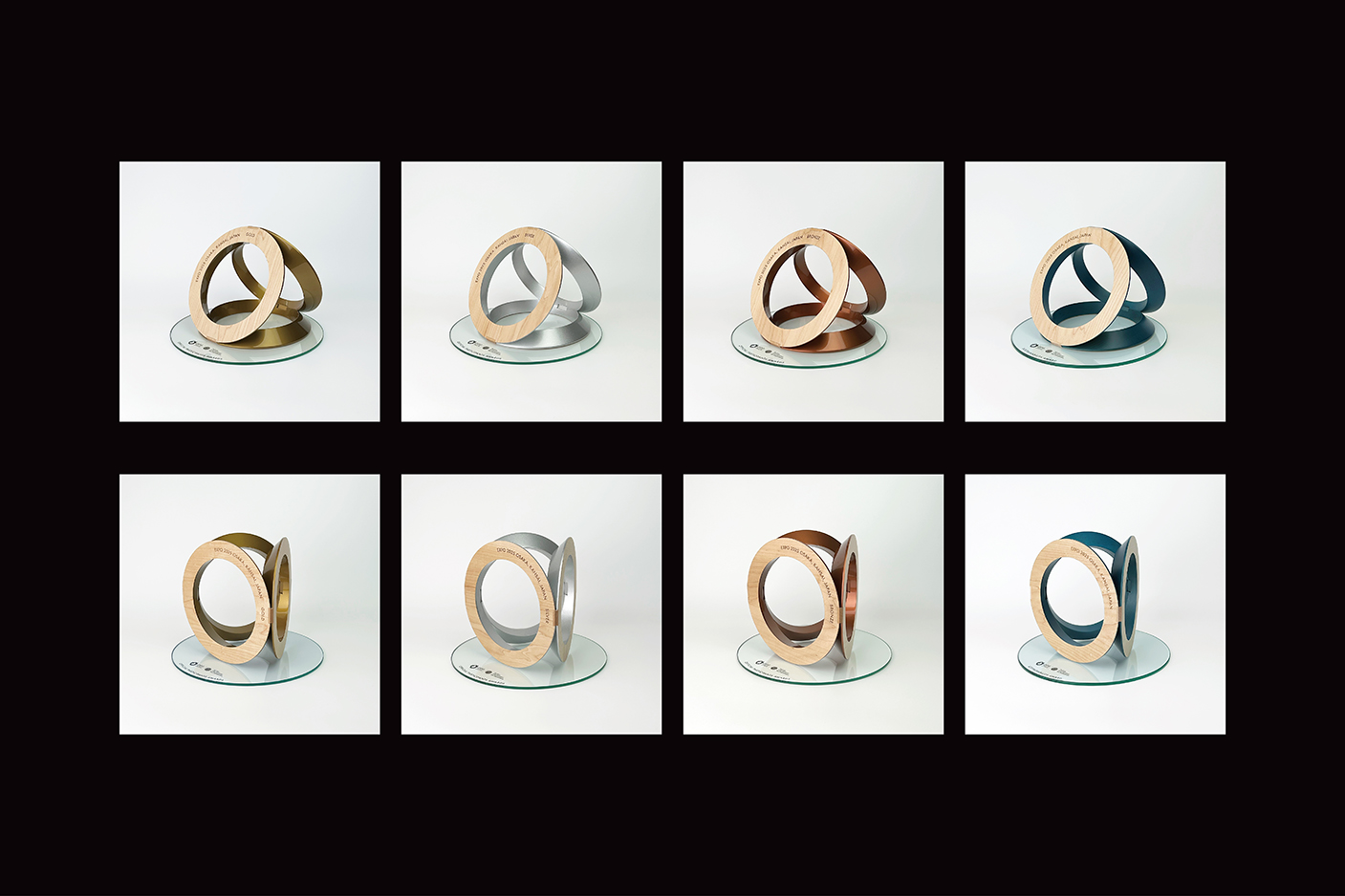 賞の種類に応じて、金・銀・銅・藍色で仕上げられたBIEデー褒賞トロフィー